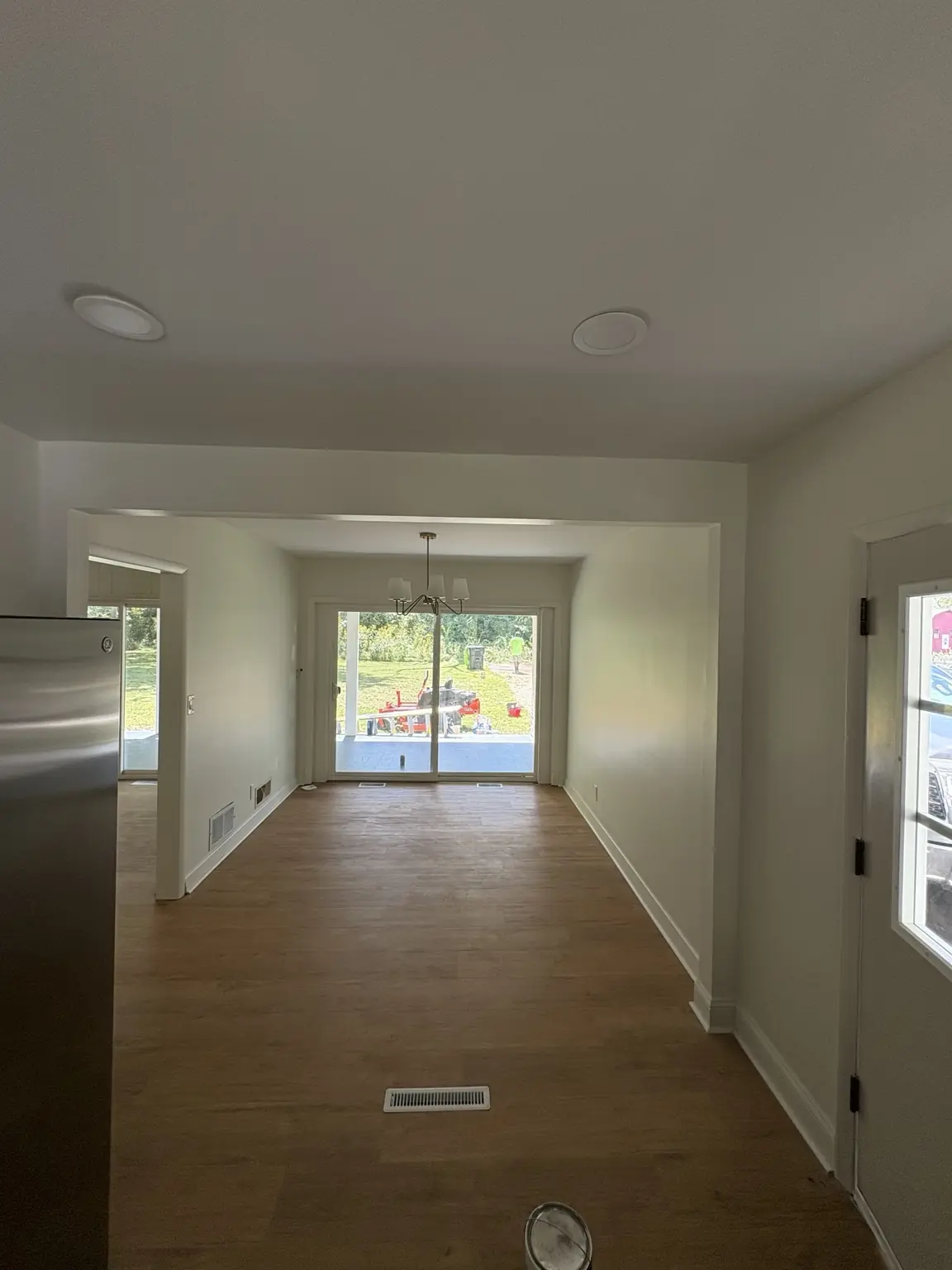 Completed Alabaster satin repaint in an open dining area with French doors