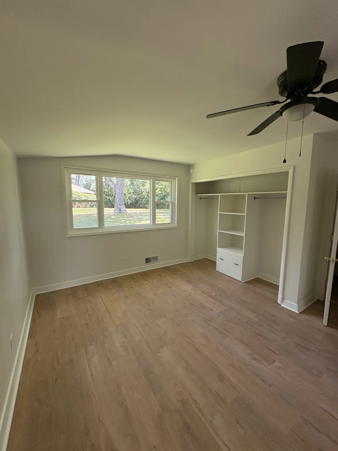 Finished bedroom with Alabaster satin walls, ceiling, trim, and built-in shelving