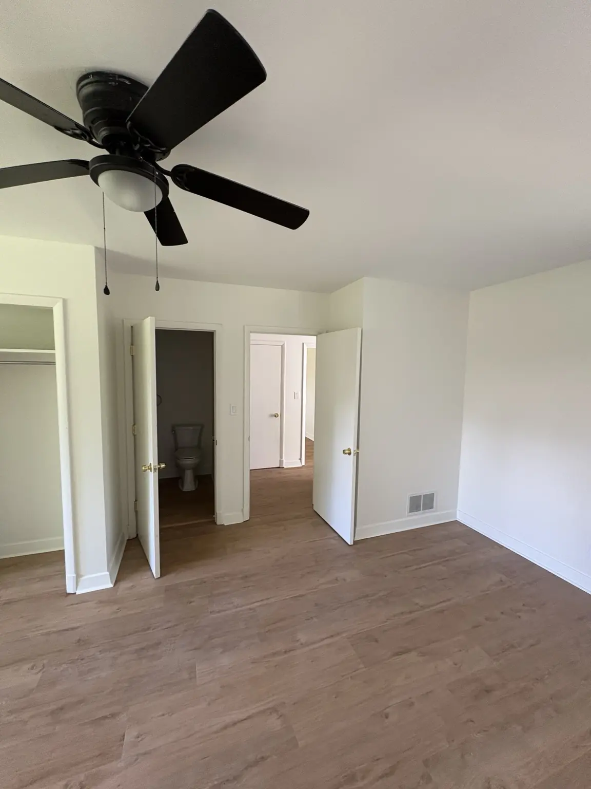 Freshly repainted bedroom showing smooth Alabaster satin walls, ceiling, and trim