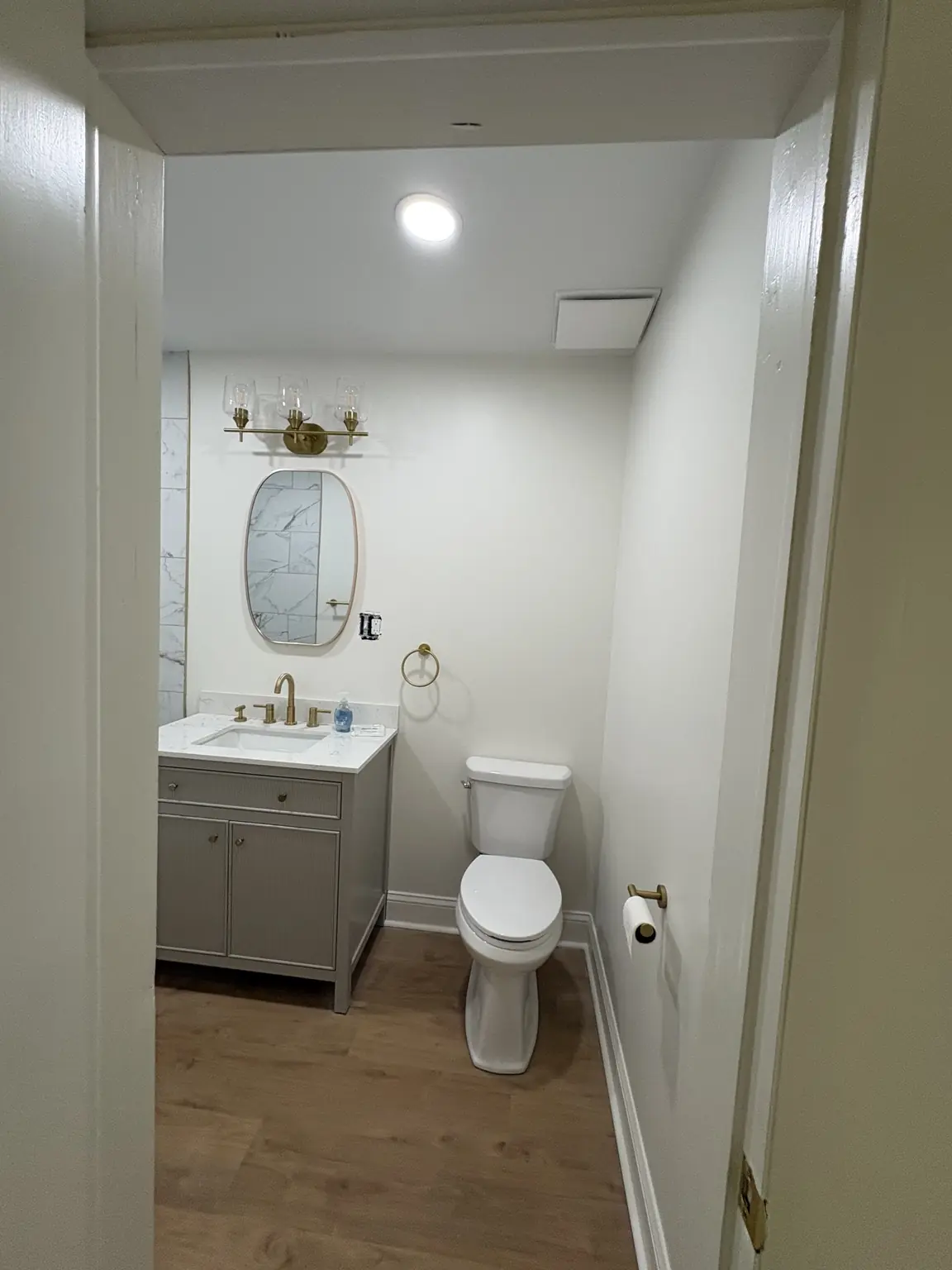 Completed Alabaster satin bathroom repaint around the vanity and fixtures