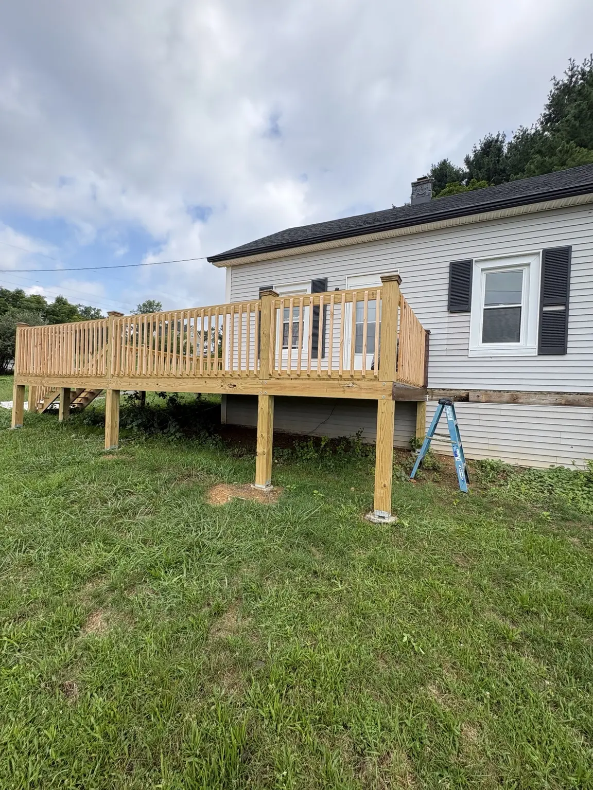 Side view of the new natural wood deck before semi-transparent staining