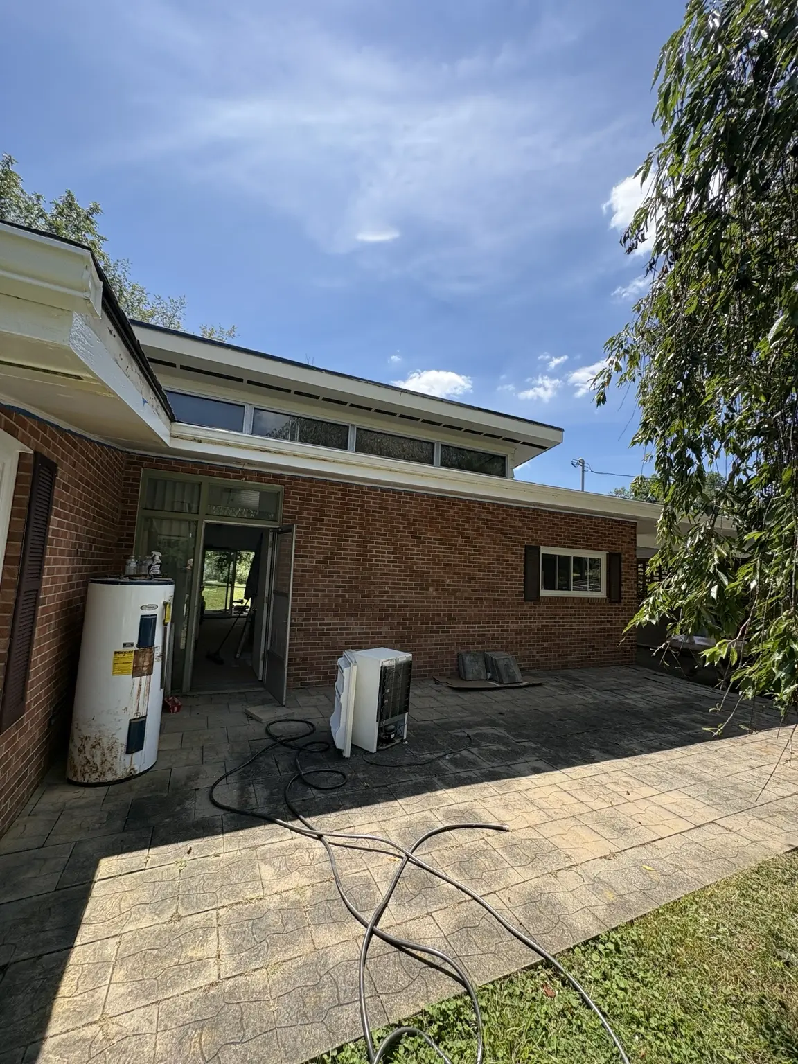 Rear exterior of the home before painting